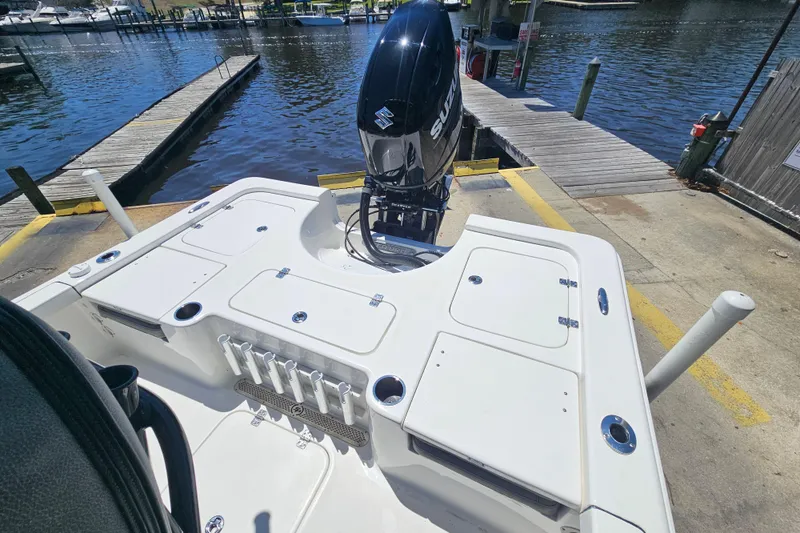 Slide: The Image of 2022 Sea Pro 228 Bay boat with Suzuki outboard motor at dockside. - 12