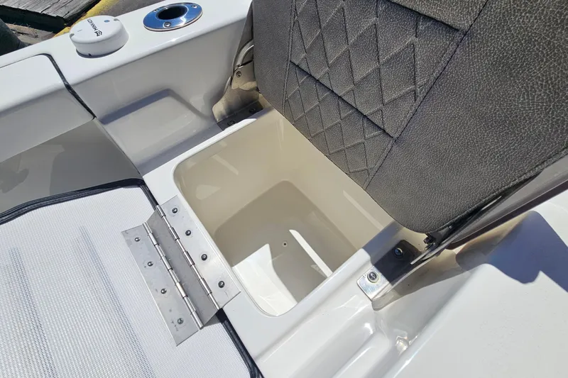 Slide: The Image of 2022 Sea Pro 228 Bay boat seat with storage compartment open. - 16