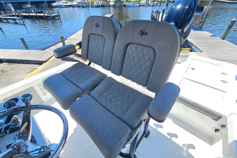 Slide: The Image of 2022 Sea Pro 228 Bay boat seats with quilted design at marina dock. - 18