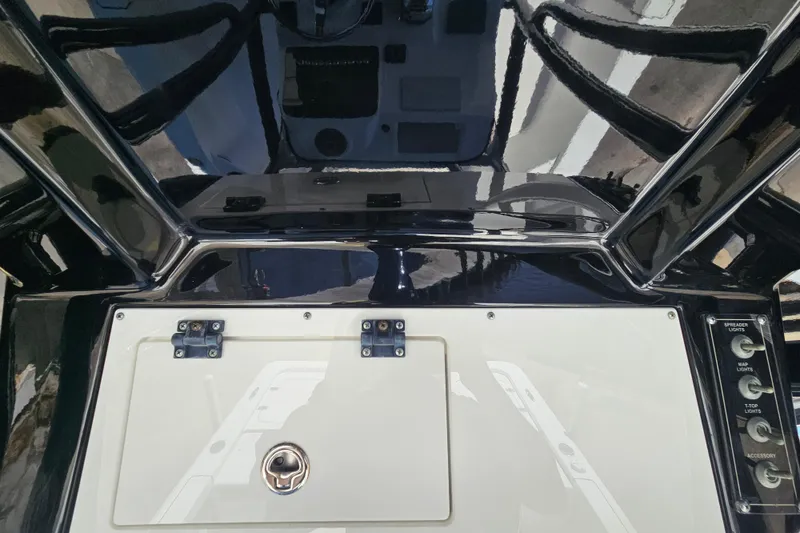 Slide: The Image of 2022 Sea Pro 228 Bay boat dashboard with control panel and storage compartment. - 20