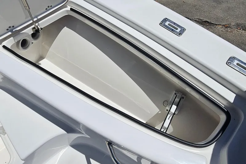 Slide: The Image of Open storage compartment on a 2022 Sea Pro 228 Bay boat. - 25