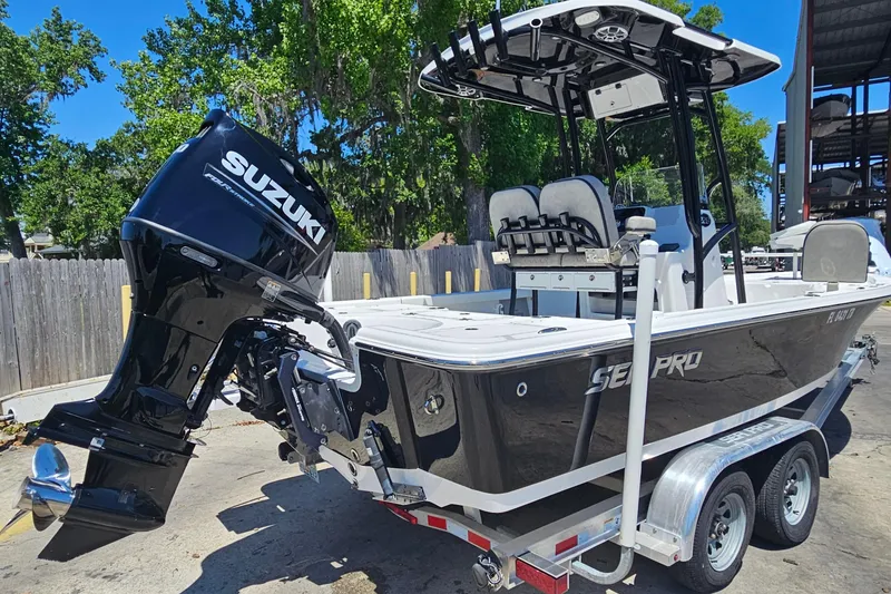 Slide: The Image of 2022 Sea Pro 228 Bay boat with Suzuki outboard motor on trailer. - 3