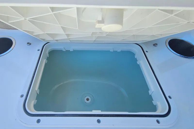 Slide: The Image of Open storage compartment on a 2022 Sea Pro 228 Bay boat. - 30
