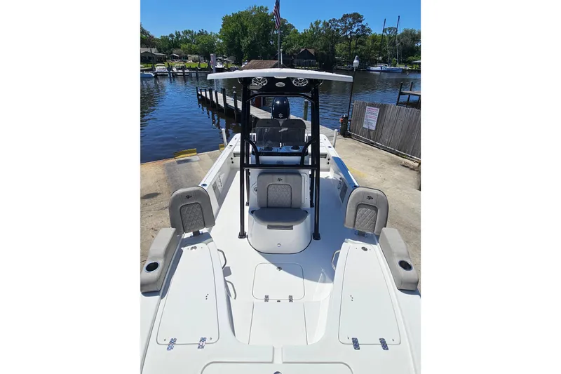 Slide: The Image of 2022 Sea Pro 228 Bay boat docked by a serene waterfront. - 34