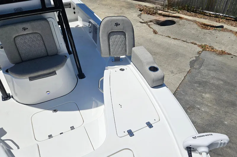Slide: The Image of 2022 Sea Pro 228 Bay boat interior with seating and Minn Kota trolling motor. - 36