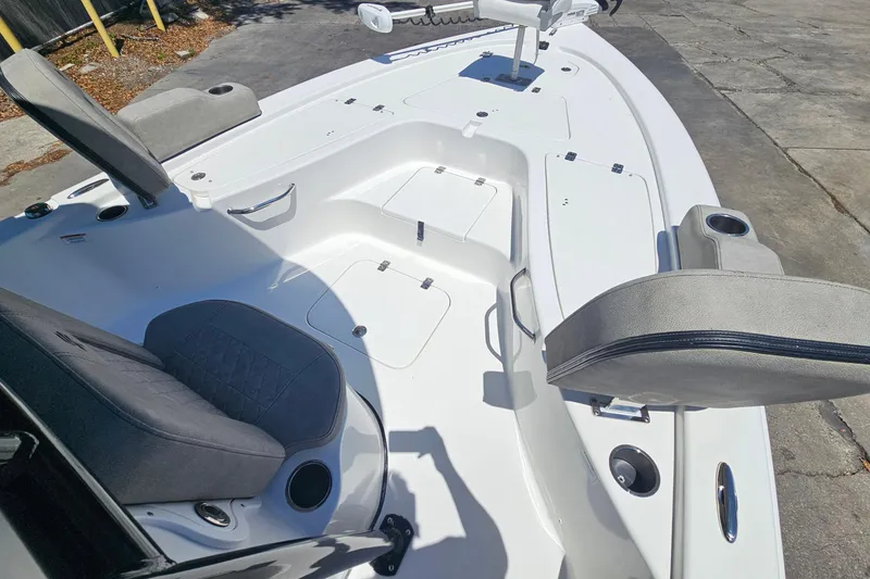 Slide: The Image of 2022 Sea Pro 228 Bay boat interior with seating and storage compartments. - 37