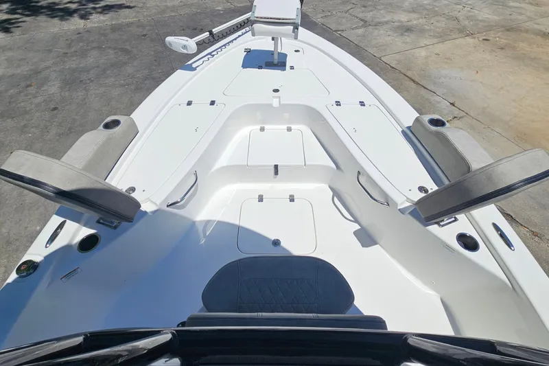 Slide: The Image of 2022 Sea Pro 228 Bay boat deck with seating and storage compartments. - 38