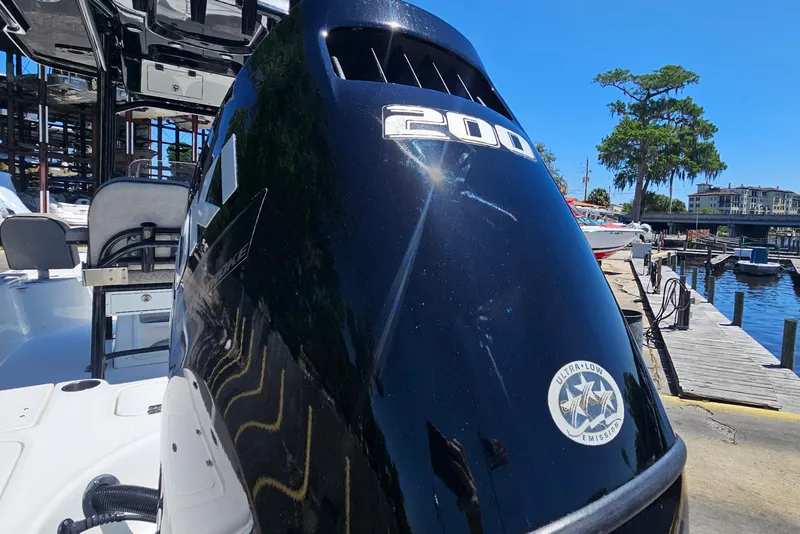 Slide: The Image of 2022 Sea Pro 228 Bay boat with powerful 200 HP engine at marina dock. - 5