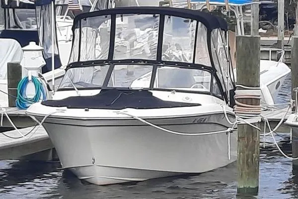 Slide: The Image of 2016 Grady-White Freedom 205 boat docked with protective canopy. - 13