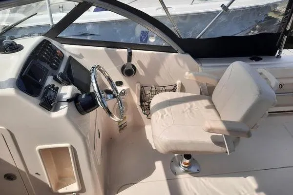 Slide: The Image of 2016 Grady-White Freedom 205 boat interior with steering wheel and captain's chair. - 15
