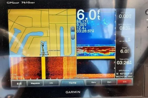 Slide: The Image of Garmin GPS display on 2016 Grady-White Freedom 205, showing depth and navigation data. - 18