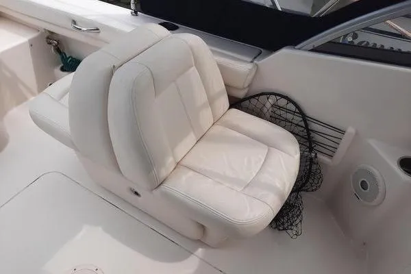 Slide: The Image of Luxurious white seating on 2016 Grady-White Freedom 205 boat interior. - 21