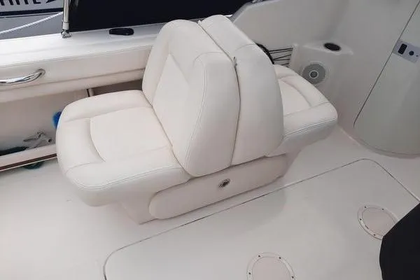 Slide: The Image of 2016 Grady-White Freedom 205 boat interior with white cushioned seating. - 22