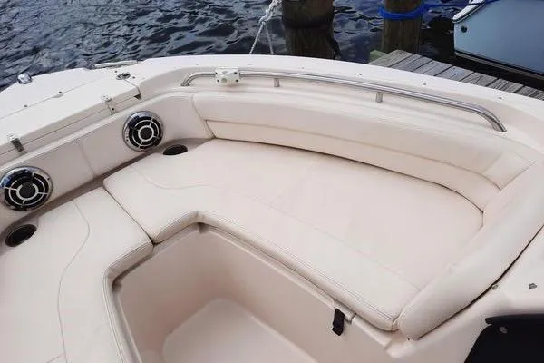 Slide: The Image of 2016 Grady-White Freedom 205 boat interior with cushioned seating and speakers. - 23