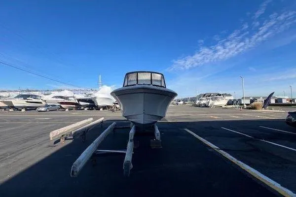 Slide: The Image of 2016 Grady-White Freedom 205 boat on trailer in marina parking lot. - 32