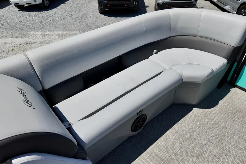 Slide: The Image of 2024 Bentley Pontoons 24 Legacy interior with gray seating and speaker detail. - 5