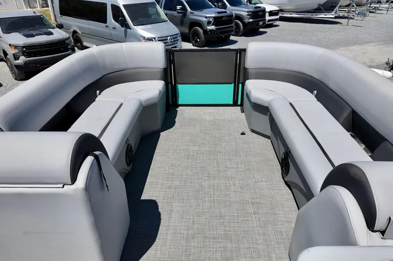 Slide: The Image of 2024 Bentley Pontoons 24 Legacy interior with gray seating and spacious layout. - 6