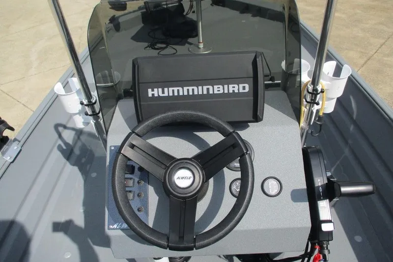 Slide: The Image of 2023 Alweld 1756 Marsh boat dashboard with Humminbird navigation system and steering wheel. - 4