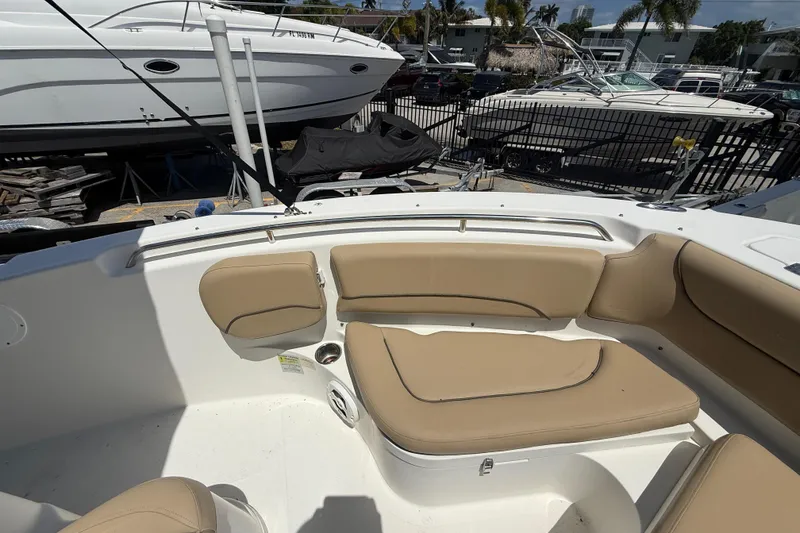 Slide: The Image of Storage compartment on a 2019 NauticStar 2102 Legacy boat with life jackets inside. - 16
