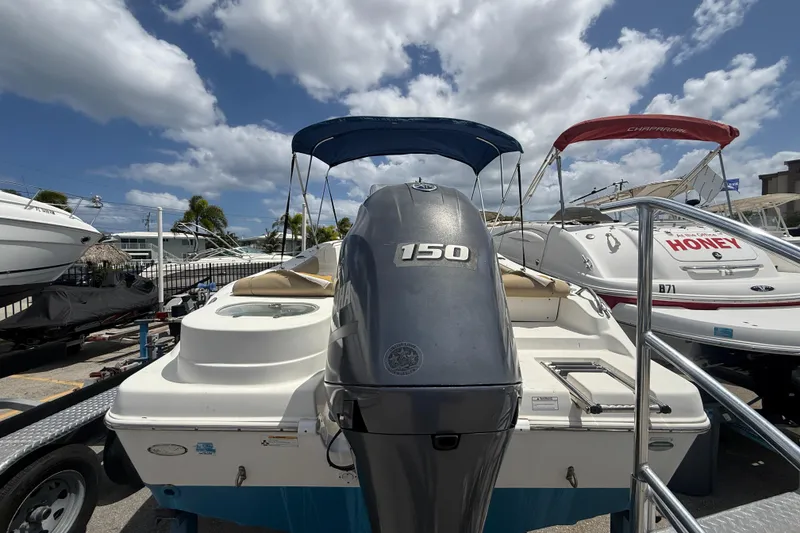 Slide: The Image of 2019 NauticStar 2102 Legacy boat cockpit with steering wheel and control panel. - 2