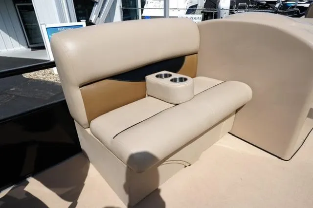 Slide: The Image of Beige leather seating with cup holders in a 2017 Bentley 244 boat interior. - 14