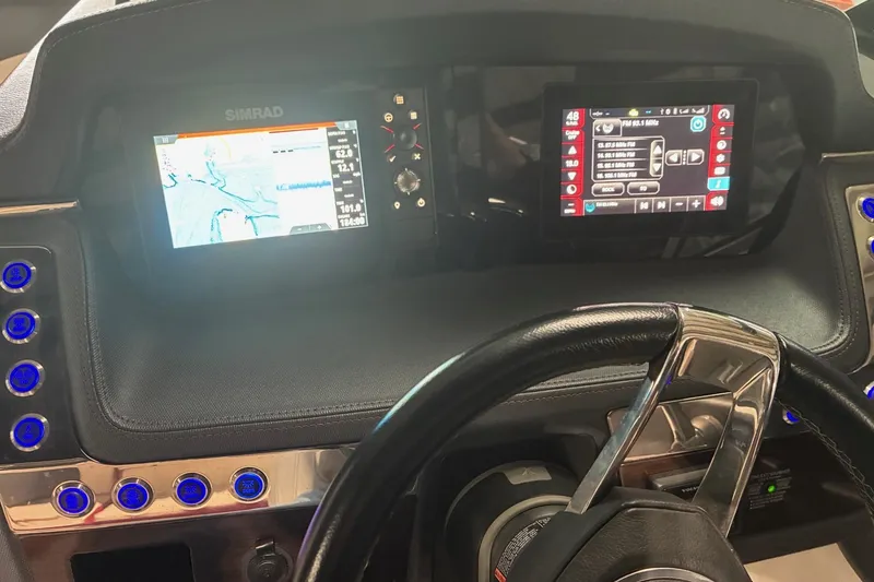 Slide: The Image of 2020 Chaparral 25 Surf dashboard with navigation and control screens. - 14