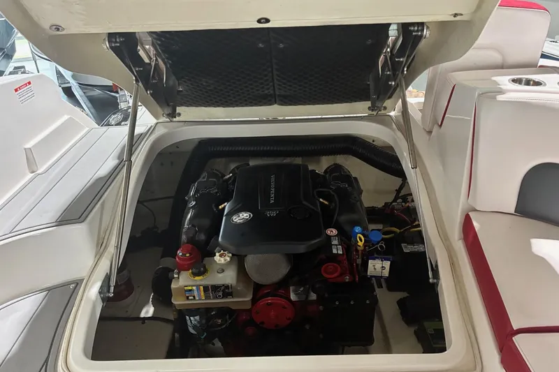 Slide: The Image of Engine compartment of a 2020 Chaparral 25 Surf boat with open hatch. - 17