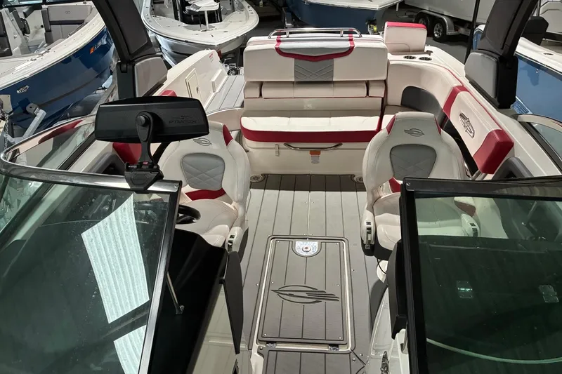 Slide: The Image of 2020 Chaparral 25 Surf boat interior with seating and dashboard view. - 22