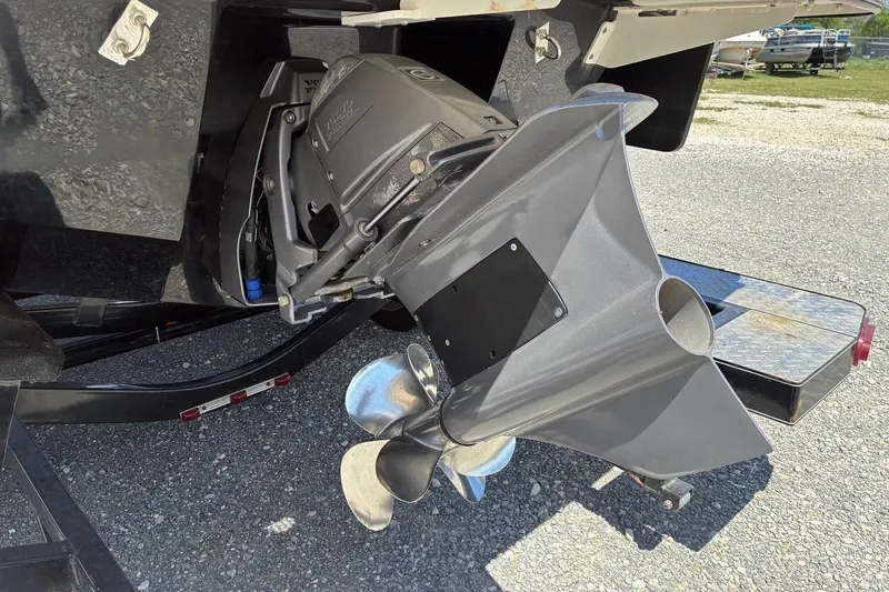 Slide: The Image of 2020 Chaparral 25 Surf boat's propeller and outdrive on a trailer. - 6