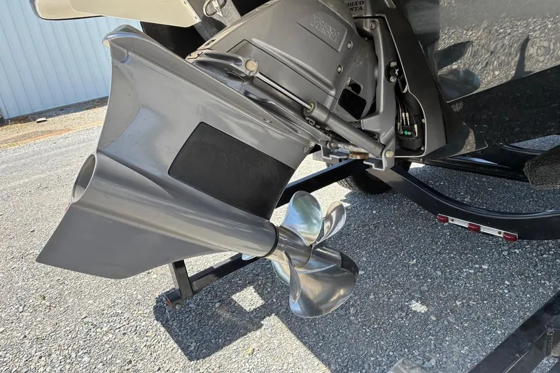 Slide: The Image of 2020 Chaparral 25 Surf boat propeller and outdrive detail on trailer. - 7
