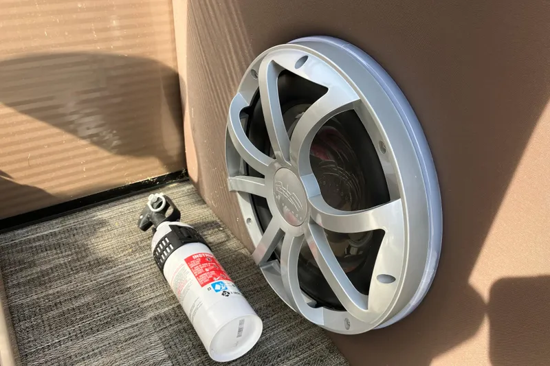 Slide: The Image of Speaker and fire extinguisher on Godfrey Monaco 255 SB boat, 2023 model. - 14