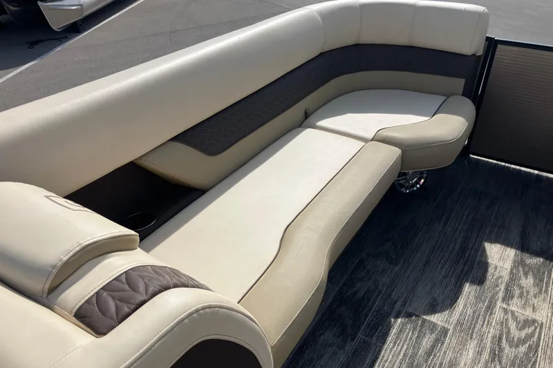 Slide: The Image of Luxurious seating on 2023 Godfrey Monaco 255 SB pontoon boat, featuring elegant beige upholstery. - 21