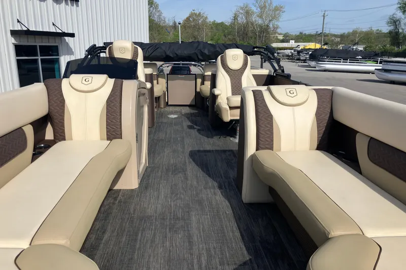 Slide: The Image of 2023 Godfrey Monaco 255 SB pontoon boat with luxurious seating and modern design. - 27
