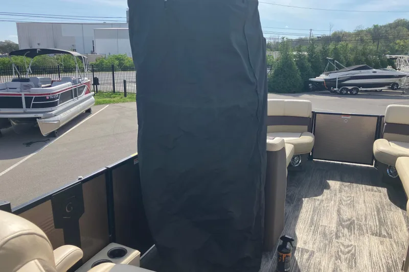 Slide: The Image of 2023 Godfrey Monaco 255 SB pontoon boat interior with seating and covered area. - 4