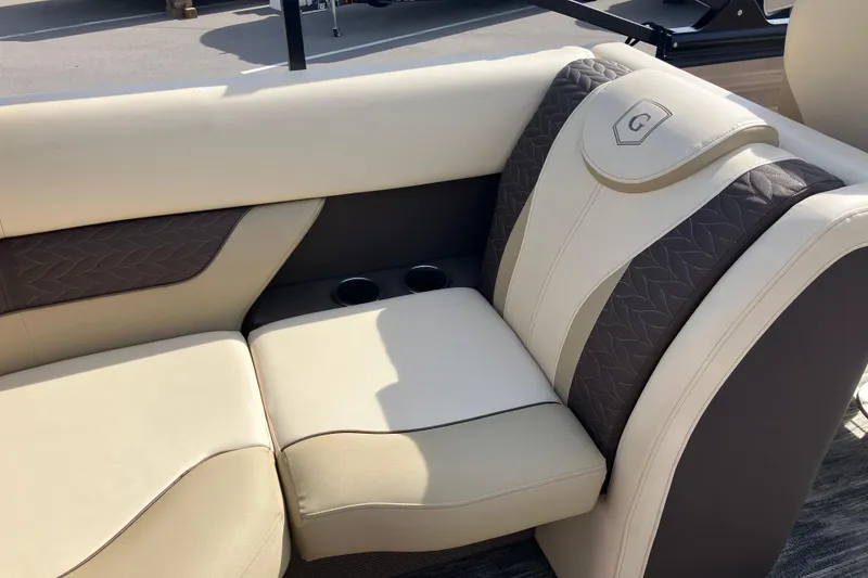 Slide: The Image of Luxurious seating on 2023 Godfrey Monaco 255 SB pontoon boat with cup holders. - 6