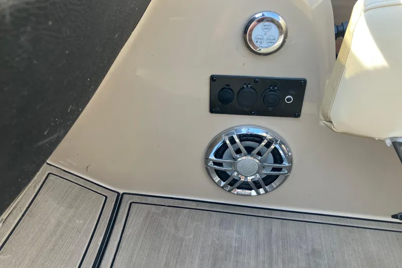 Slide: The Image of Control panel and speaker on 2023 Godfrey Monaco 255 SB boat interior. - 9