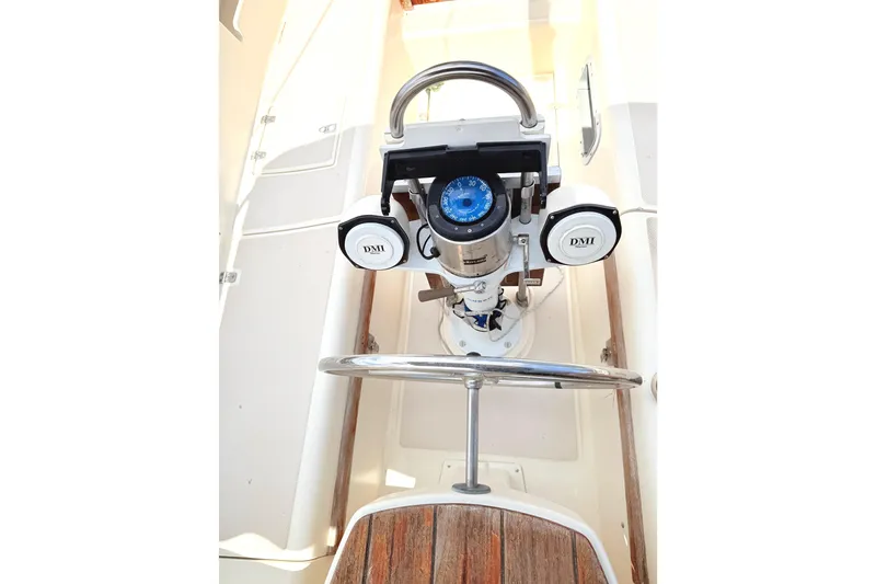 Slide: The Image of Steering wheel and compass on 1984 Island Packet sailboat deck. - 11