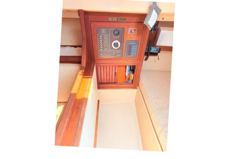 Slide: The Image of 1984 Island Packet boat interior with control panel and wooden accents. - 25