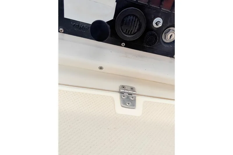 Slide: The Image of Close-up of a 1984 Island Packet boat control panel with hinge detail. - 36
