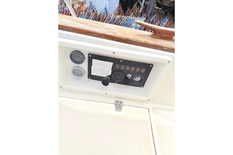 Slide: The Image of Control panel of a 1984 Island Packet boat with gauges and switches. - 7
