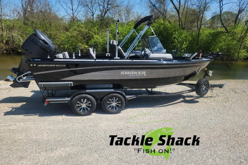 The Image of 2026 Smoker Craft Adventurer 210 GLS Sport boat on trailer, parked near a river. - 0