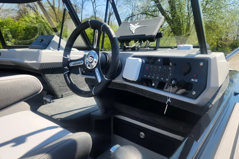 Slide: The Image of Interior view of 2026 Smoker Craft Adventurer 210 GLS Sport boat dashboard and steering wheel. - 10