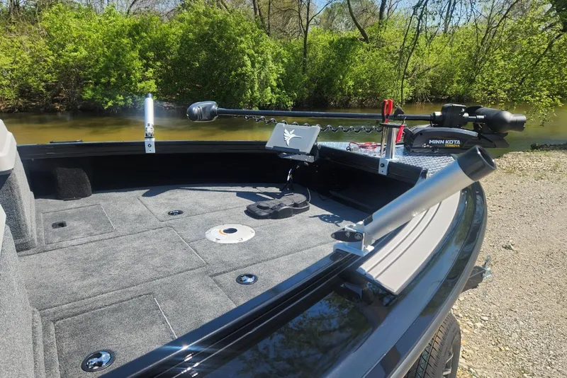 Slide: The Image of 2026 Smoker Craft Adventurer 210 GLS Sport boat with Minn Kota Terrova motor on a scenic river. - 11