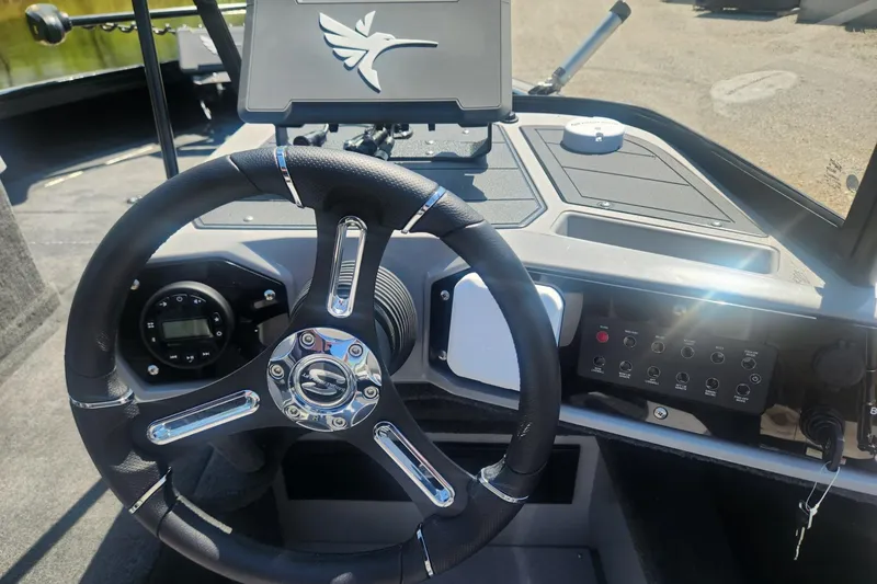 Slide: The Image of Steering wheel and dashboard of 2026 Smoker Craft Adventurer 210 GLS Sport boat. - 26