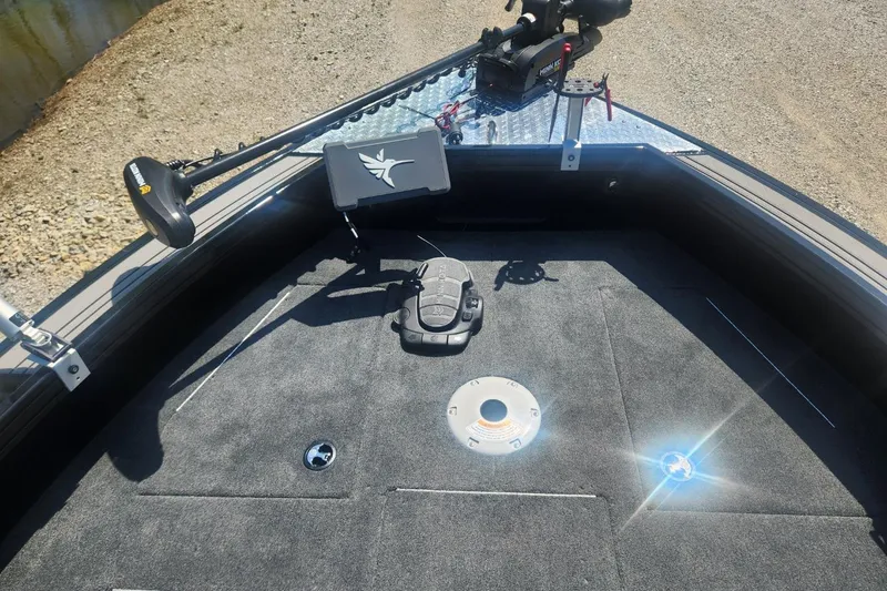 Slide: The Image of 2026 Smoker Craft Adventurer 210 GLS Sport boat deck with fishing equipment. - 27