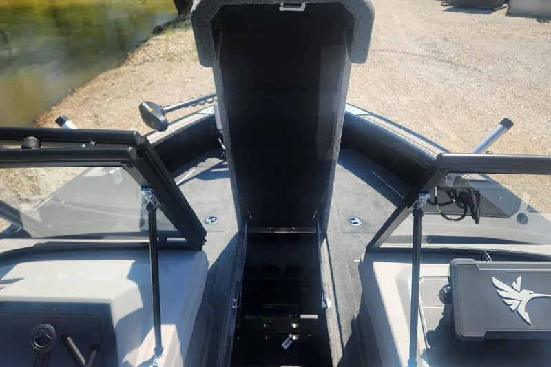 Slide: The Image of 2026 Smoker Craft Adventurer 210 GLS Sport boat interior with open storage compartment. - 31
