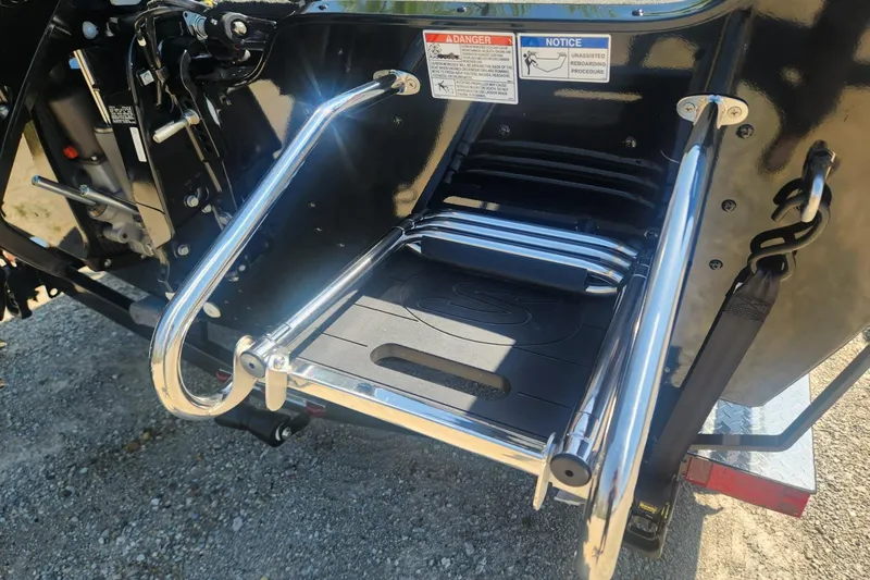 Slide: The Image of 2026 Smoker Craft Adventurer 210 GLS Sport boat ladder and engine detail. - 33