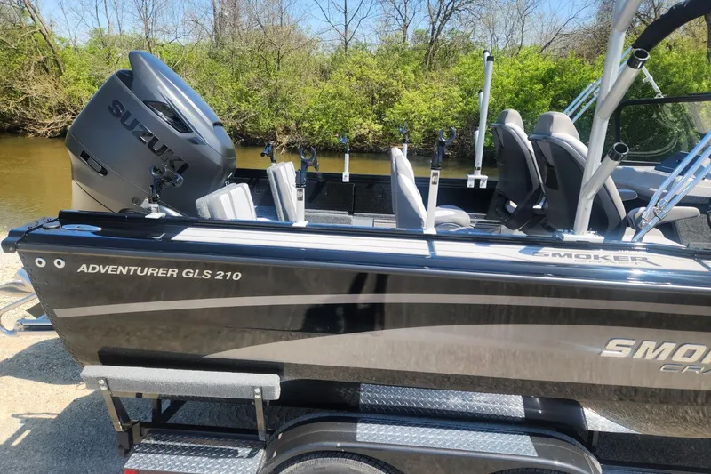 Slide: The Image of 2026 Smoker Craft Adventurer 210 GLS Sport boat with Suzuki engine by a river. - 8