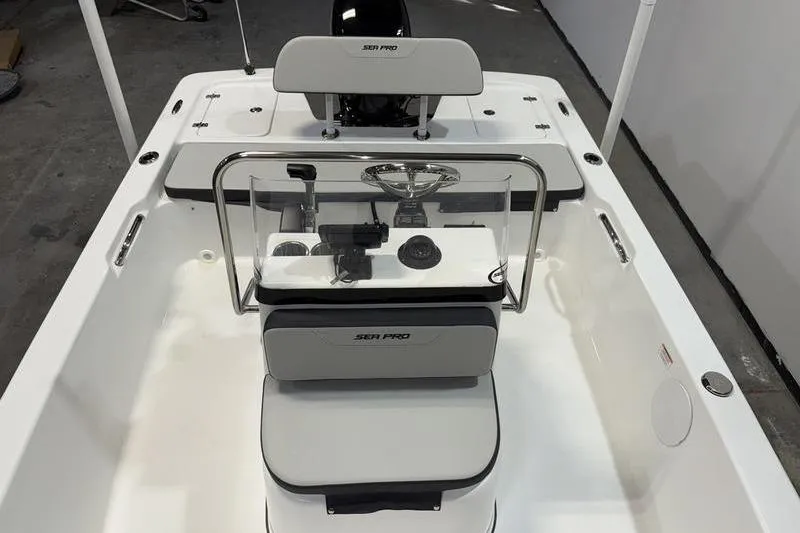 Slide: The Image of 2026 Sea Pro 172 Bay boat interior with steering console and seating. - 13