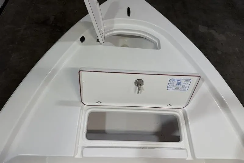 Slide: The Image of 2026 Sea Pro 172 Bay boat storage compartment with key lock and open hatch. - 16